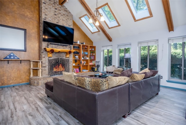 310 Karen Dr, Lufkin, TX 75901 - living room featuring a skylight, wood finished floors, high vaulted ceiling, and beamed ceiling