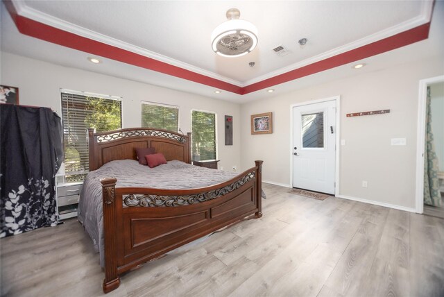 310 Karen Dr, Lufkin, TX 75901 - bedroom with a tray ceiling, light wood-style flooring, visible vents, and ornamental molding