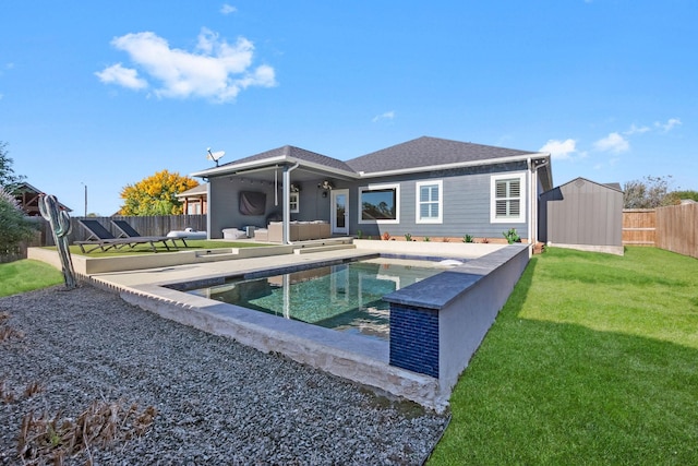 back of property with a shed and an outbuilding