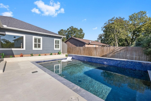view of pool featuring a fenced backyard and a patio area