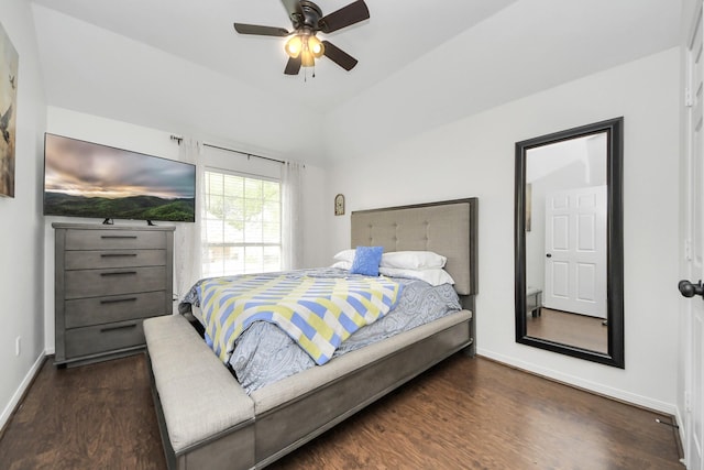 bedroom featuring baseboards, ceiling fan, and wood finished floors