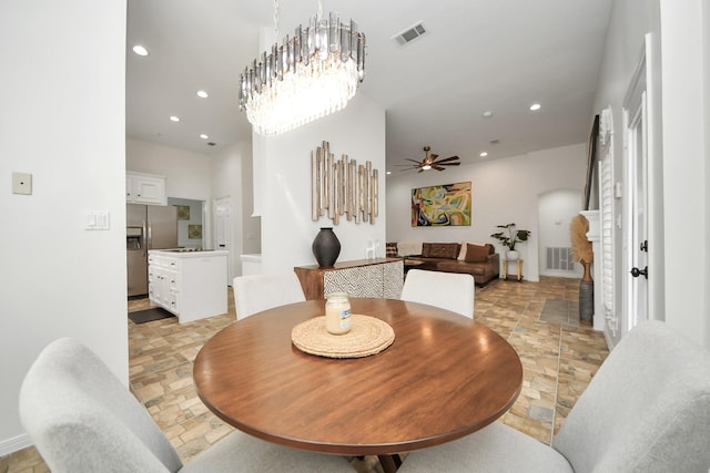 dining room with stone tile flooring, recessed lighting, ceiling fan, and visible vents