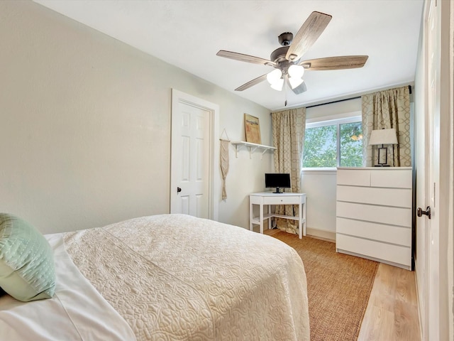 1002 Staples Ave, Seabrook, TX 77586 - bedroom with wood finished floors and a ceiling fan