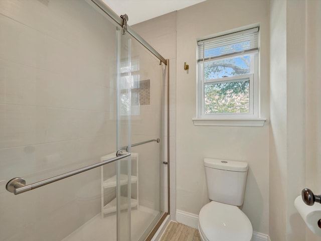1002 Staples Ave, Seabrook, TX 77586 - full bathroom with toilet, a stall shower, and baseboards