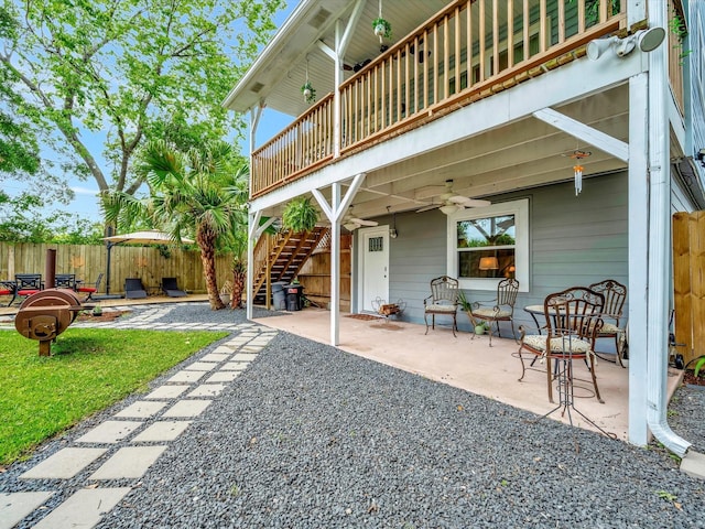1002 Staples Ave, Seabrook, TX 77586 - view of patio with ceiling fan, fence, and stairway
