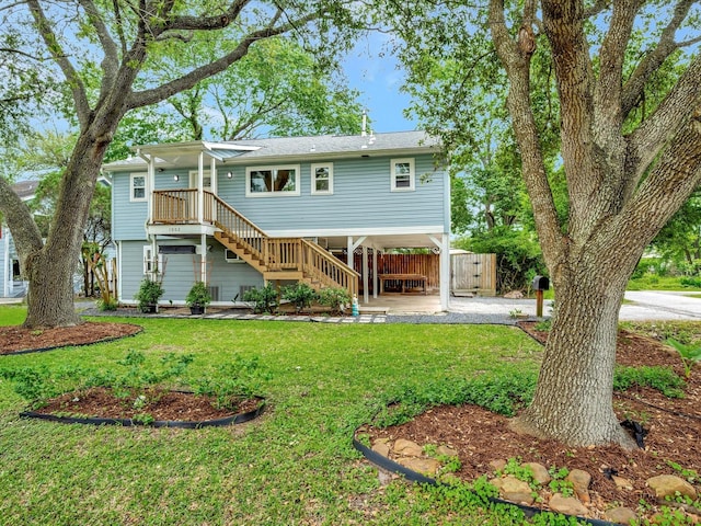 1002 Staples Ave, Seabrook, TX 77586 - rear view of property with stairway and a carport