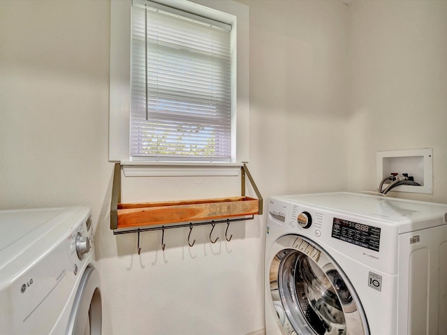 1002 Staples Ave, Seabrook, TX 77586 - clothes washing area with independent washer and dryer
