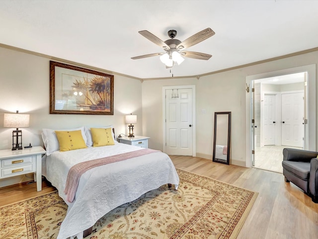 1002 Staples Ave, Seabrook, TX 77586 - bedroom featuring light wood-style flooring, ornamental molding, baseboards, and ceiling fan
