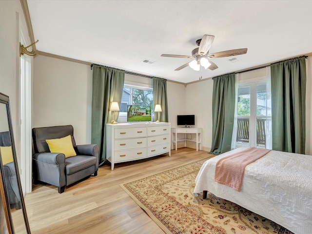1002 Staples Ave, Seabrook, TX 77586 - bedroom featuring light wood finished floors, access to outside, and ceiling fan
