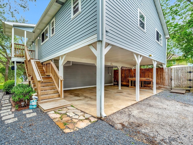 1002 Staples Ave, Seabrook, TX 77586 - view of patio / terrace featuring a carport, stairway, and fence