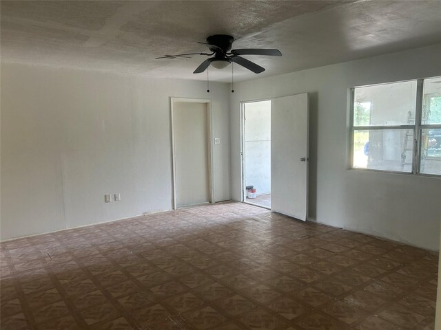 spare room with a ceiling fan