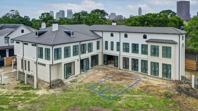 5517 Sturbridge Dr, Houston, TX 77056 - back of property with a chimney, stucco siding, and a skyline view