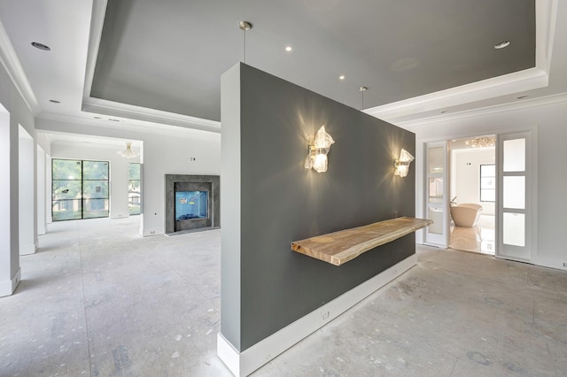 5517 Sturbridge Dr, Houston, TX 77056 - unfurnished living room with a tray ceiling, ornamental molding, a chandelier, a high end fireplace, and baseboards