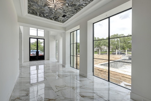 5517 Sturbridge Dr, Houston, TX 77056 - doorway with light marble finish floors, a tray ceiling, crown molding, and french doors