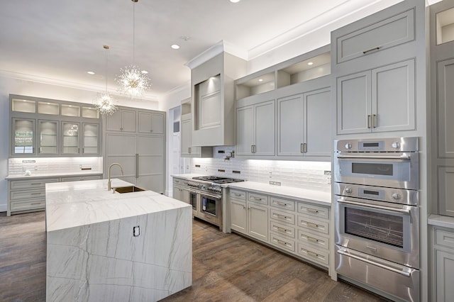 5517 Sturbridge Dr, Houston, TX 77056 - kitchen with a sink, appliances with stainless steel finishes, a warming drawer, decorative backsplash, and gray cabinets