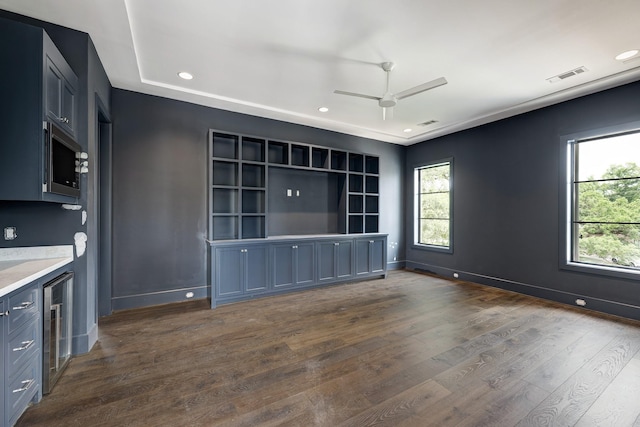 5517 Sturbridge Dr, Houston, TX 77056 - kitchen featuring wine cooler, healthy amount of natural light, a ceiling fan, stainless steel microwave, and recessed lighting