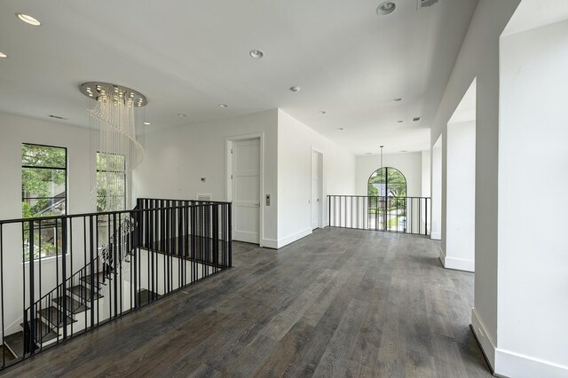 5517 Sturbridge Dr, Houston, TX 77056 - corridor with an upstairs landing, wood finished floors, baseboards, plenty of natural light, and recessed lighting