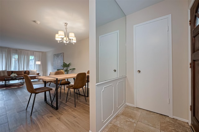 859 Wax Myrtle Ln, Houston, TX 77079 - dining area featuring a chandelier and baseboards