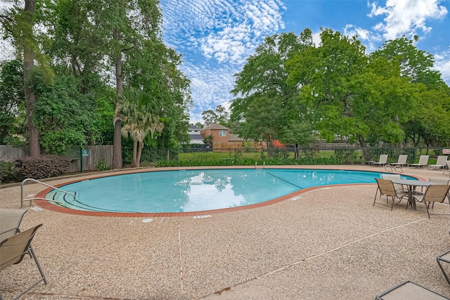859 Wax Myrtle Ln, Houston, TX 77079 - community pool featuring a patio area and fence