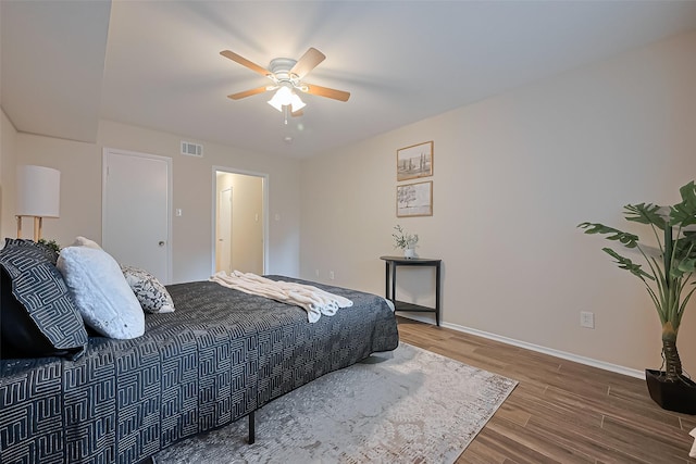 859 Wax Myrtle Ln, Houston, TX 77079 - bedroom featuring baseboards, wood finished floors, visible vents, and ceiling fan