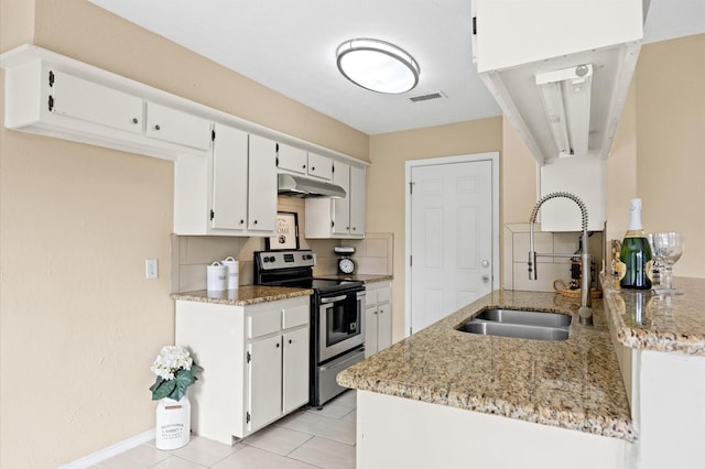 kitchen with a sink, stainless steel range with electric cooktop, white cabinetry, light stone counters, and under cabinet range hood