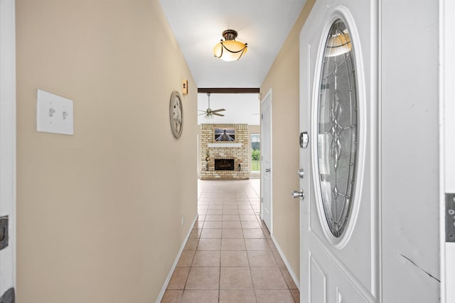 interior space featuring baseboards and light tile patterned floors