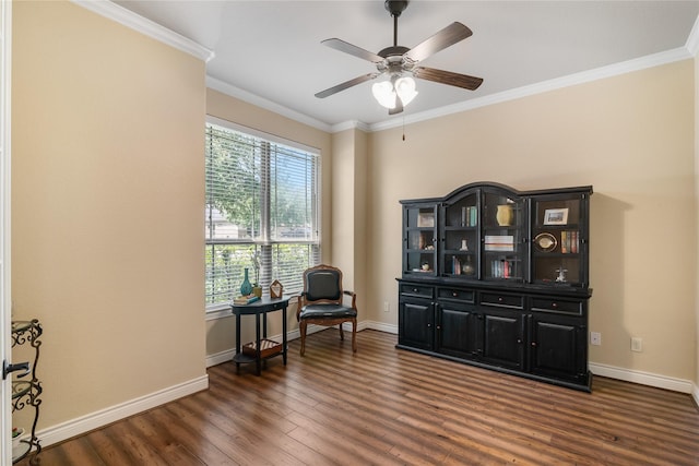 living area featuring baseboards, a ceiling fan, dark wood-style floors, and ornamental molding