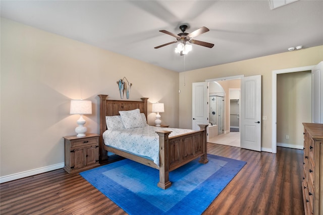 bedroom featuring wood finished floors, a ceiling fan, and baseboards