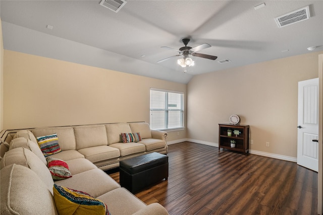 living room featuring dark wood-type flooring, visible vents, and baseboards