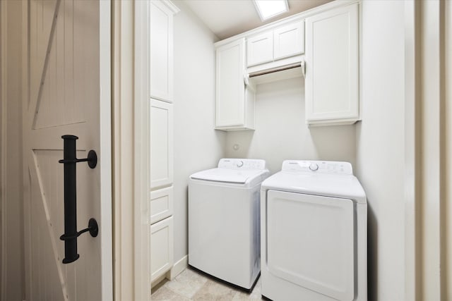 clothes washing area with cabinet space and washer and clothes dryer
