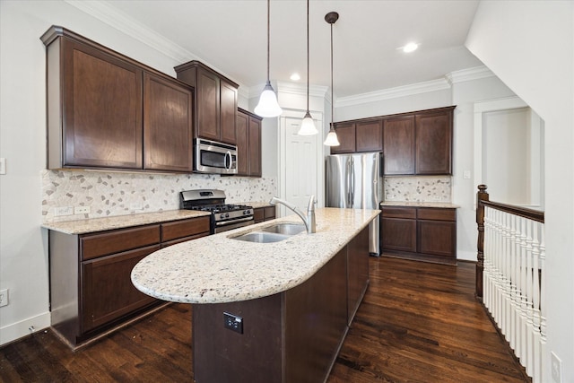 kitchen featuring dark wood-style floors, a sink, dark brown cabinets, and appliances with stainless steel finishes