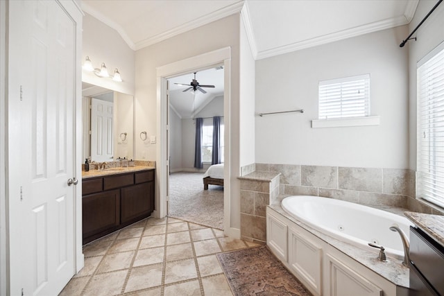 ensuite bathroom with ensuite bathroom, vanity, a ceiling fan, crown molding, and a jetted tub