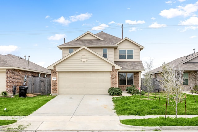 traditional-style home featuring fence, driveway, brick siding, and a front yard