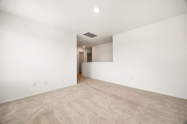 empty room with attic access, carpet flooring, baseboards, visible vents, and recessed lighting