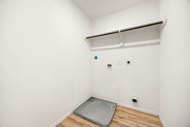 clothes washing area with light wood-type flooring, electric dryer hookup, laundry area, and washer hookup