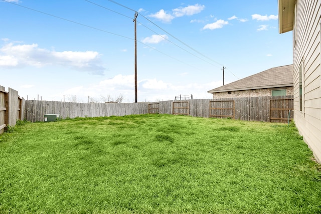 view of yard featuring a fenced backyard