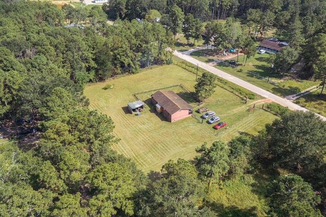 271 Woodman Dr, Cleveland, TX 77328 - bird's eye view featuring a view of trees and a rural view