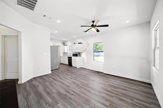 unfurnished living room with recessed lighting, visible vents, a ceiling fan, baseboards, and dark wood-style flooring