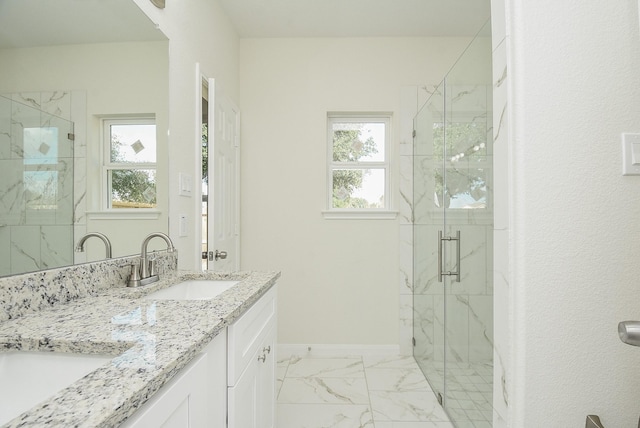 full bath with a marble finish shower, a wealth of natural light, and marble finish floor