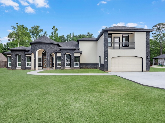 549 Rd 660, Dayton, TX 77535 - view of front of house with an attached garage, a balcony, a front yard, and stucco siding