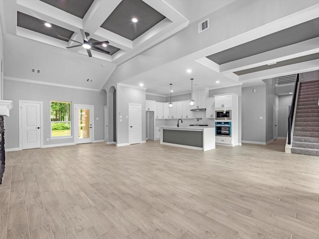 549 Rd 660, Dayton, TX 77535 - unfurnished living room with stairway, visible vents, a sink, baseboards, and ceiling fan