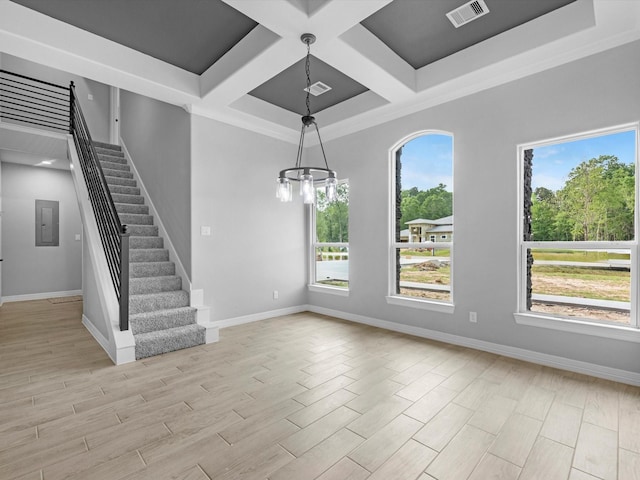 549 Rd 660, Dayton, TX 77535 - unfurnished living room featuring electric panel, baseboards, visible vents, coffered ceiling, and stairway