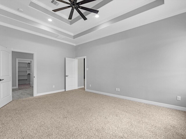 549 Rd 660, Dayton, TX 77535 - unfurnished bedroom with light carpet, a raised ceiling, baseboards, ornamental molding, and visible vents