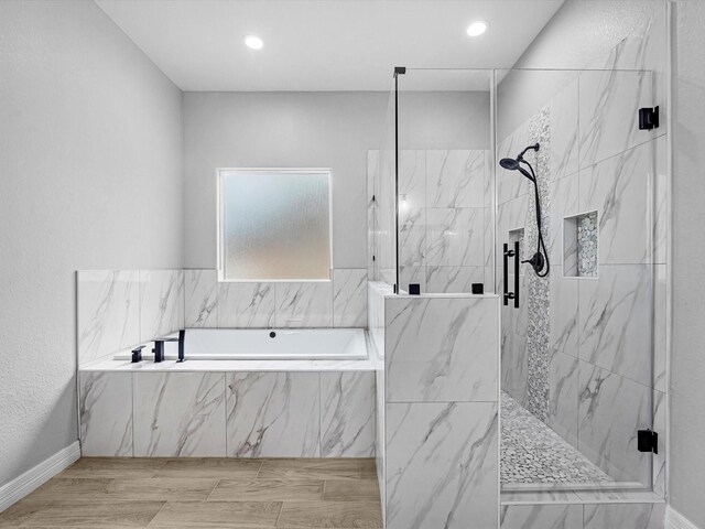 549 Rd 660, Dayton, TX 77535 - bathroom featuring a garden tub, a marble finish shower, and recessed lighting