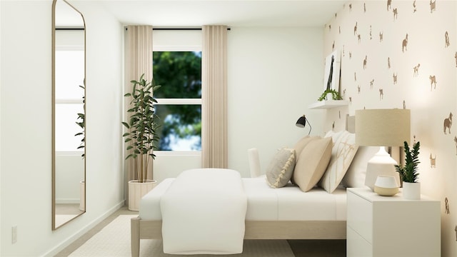 bedroom featuring baseboards and multiple windows
