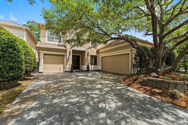 view of front of home with stucco siding and driveway