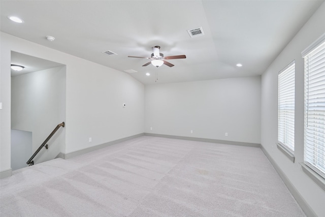 empty room featuring light carpet, visible vents, and recessed lighting
