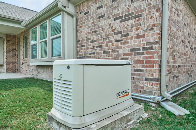 exterior details with a power unit and brick siding