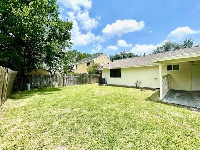 11411 Meadow Joy Dr, Houston, TX 77089 - view of yard featuring a fenced backyard, cooling unit, and a patio