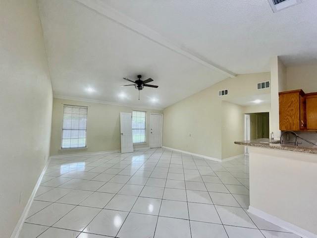 11411 Meadow Joy Dr, Houston, TX 77089 - unfurnished living room featuring light tile patterned flooring, visible vents, and a ceiling fan